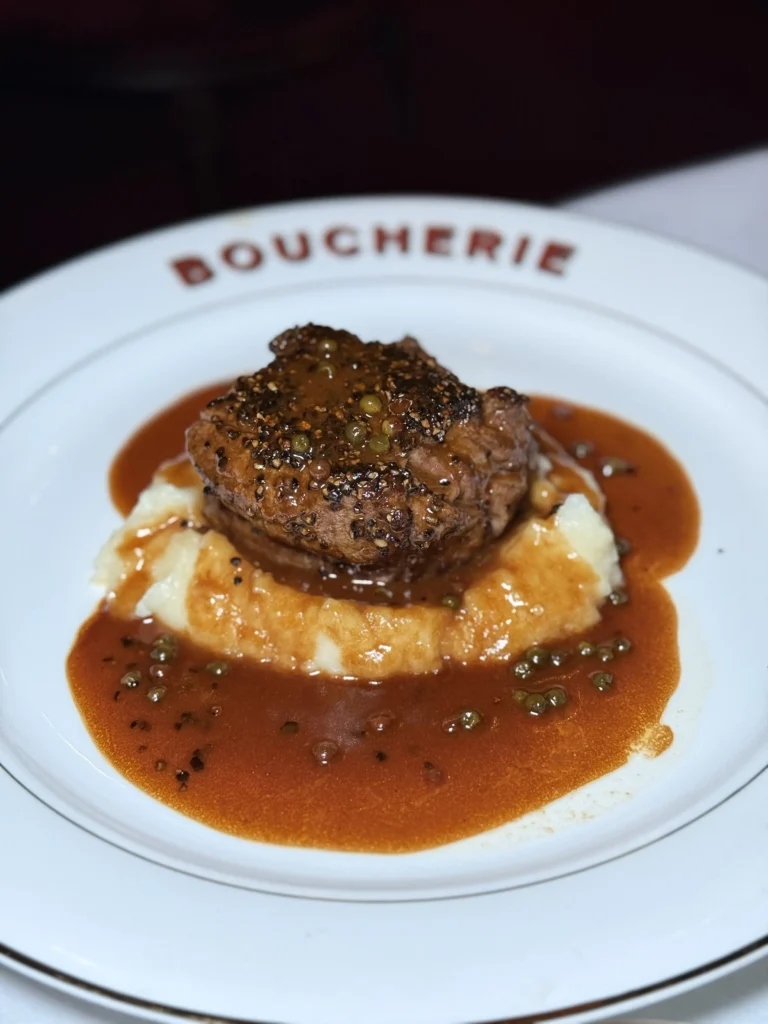 Pepper-crusted filet mignon with truffled mashed potatoes and peppercorn sauce