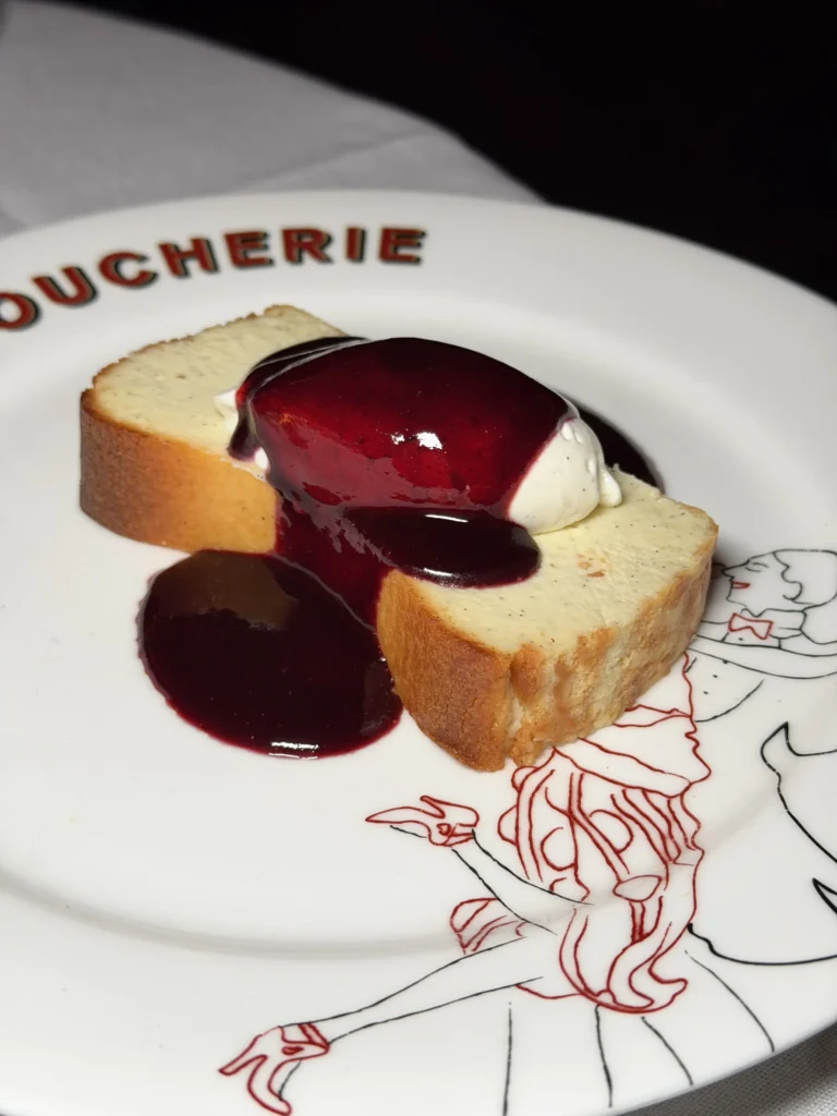 Basque cheesecake topped with poured mixed berry coulis