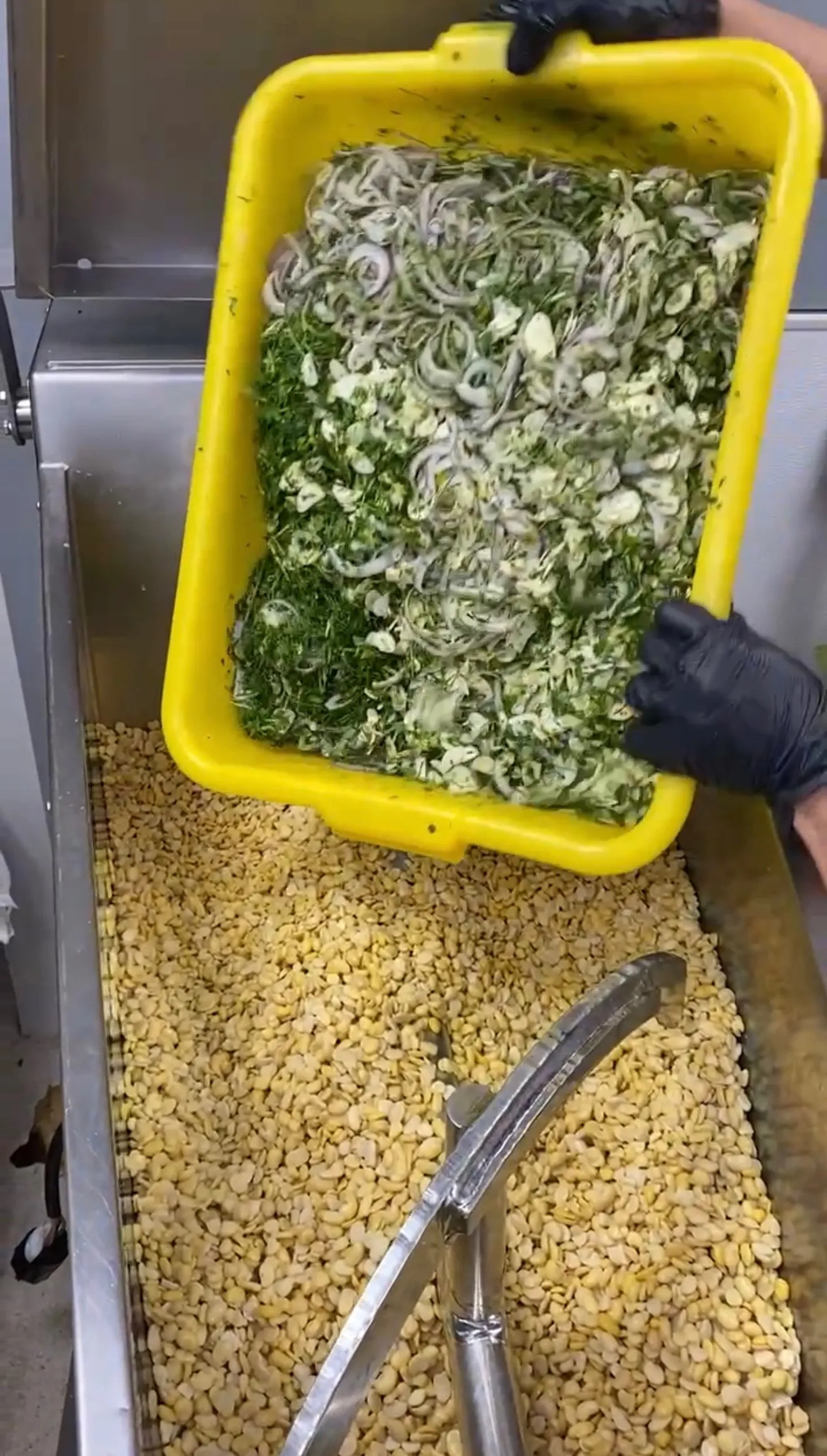 Fresh falafel mixture packed in a yellow container