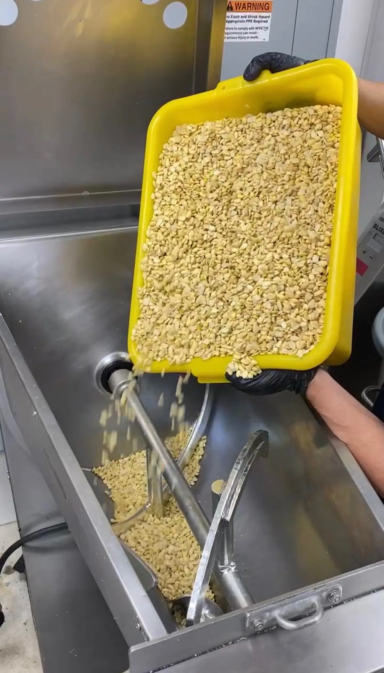Ground chickpeas in food processor during falafel preparation