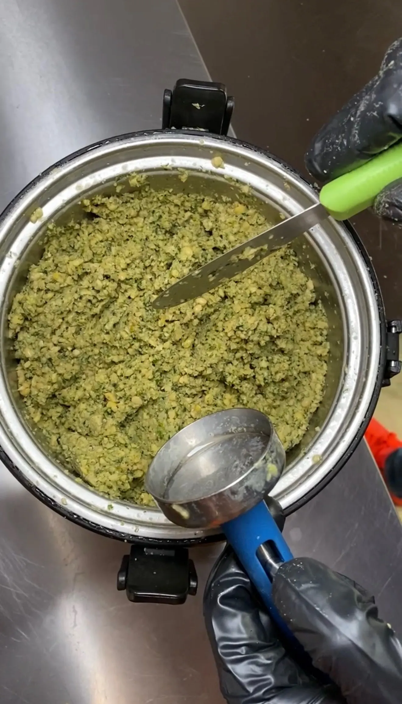 Ground falafel mixture in food processor bowl ready for shaping