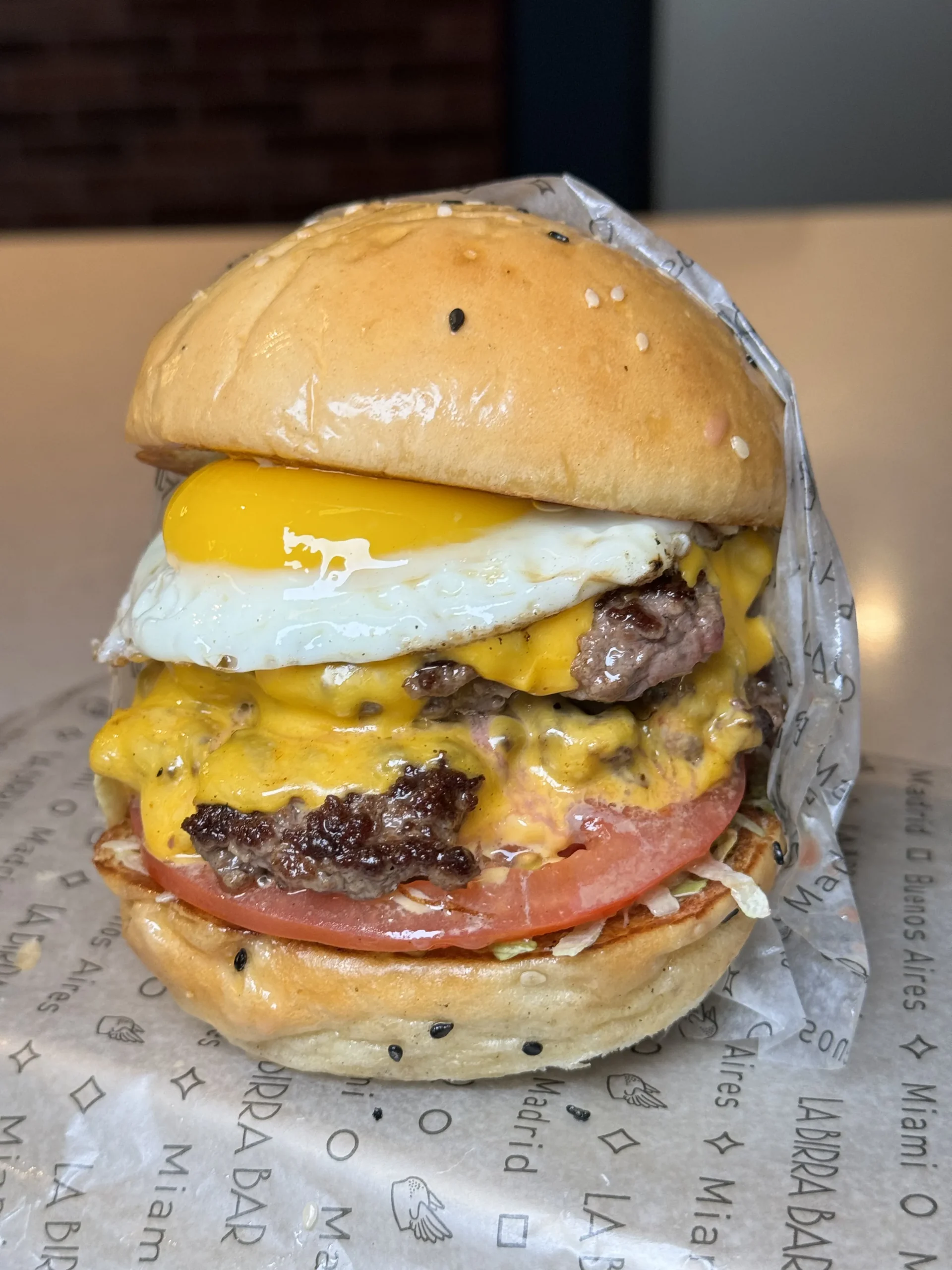 Loaded cheeseburger with fried egg and melted cheese
