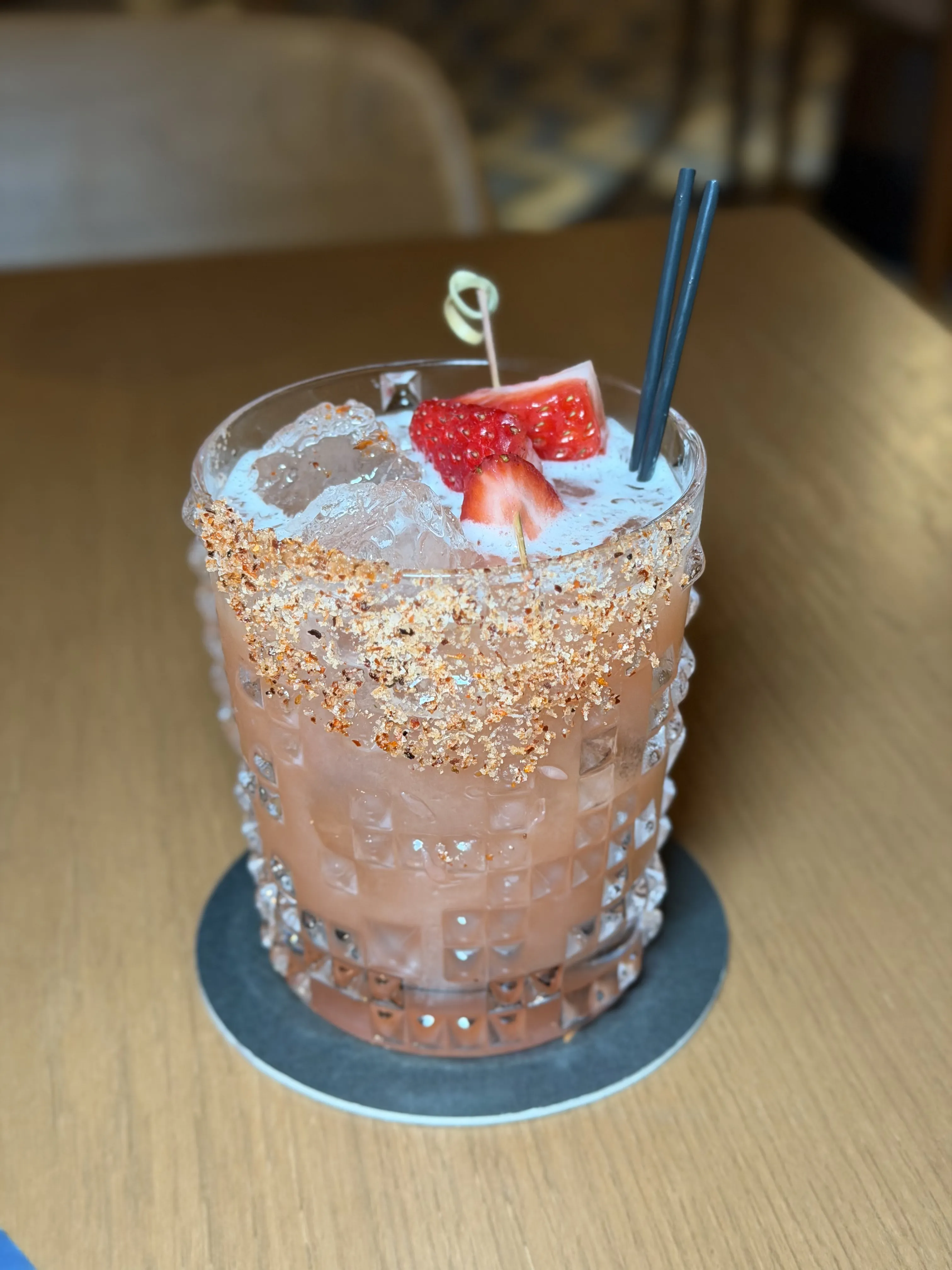 Strawberry cocktail with garnish in elegant glass