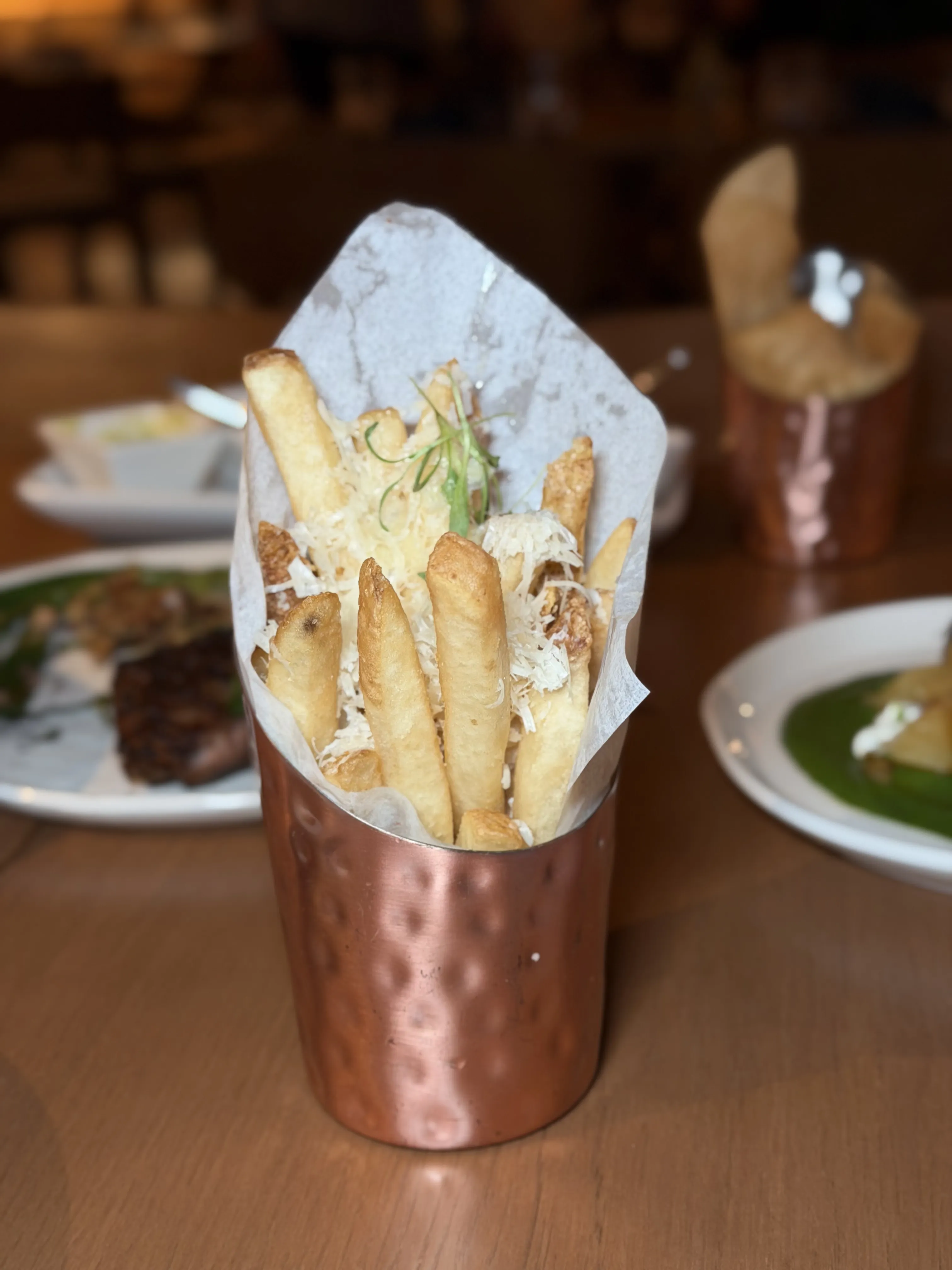 Parmesan truffle fries in copper cup