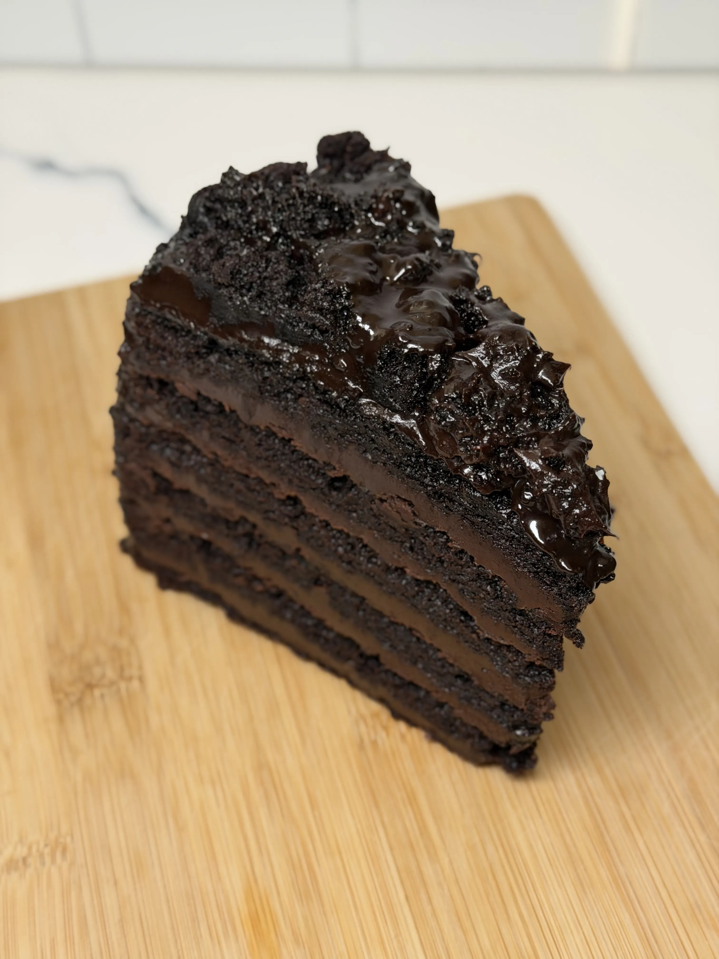 Close-up of Great Wall of Chocolate cake slice with thick ganache between layers