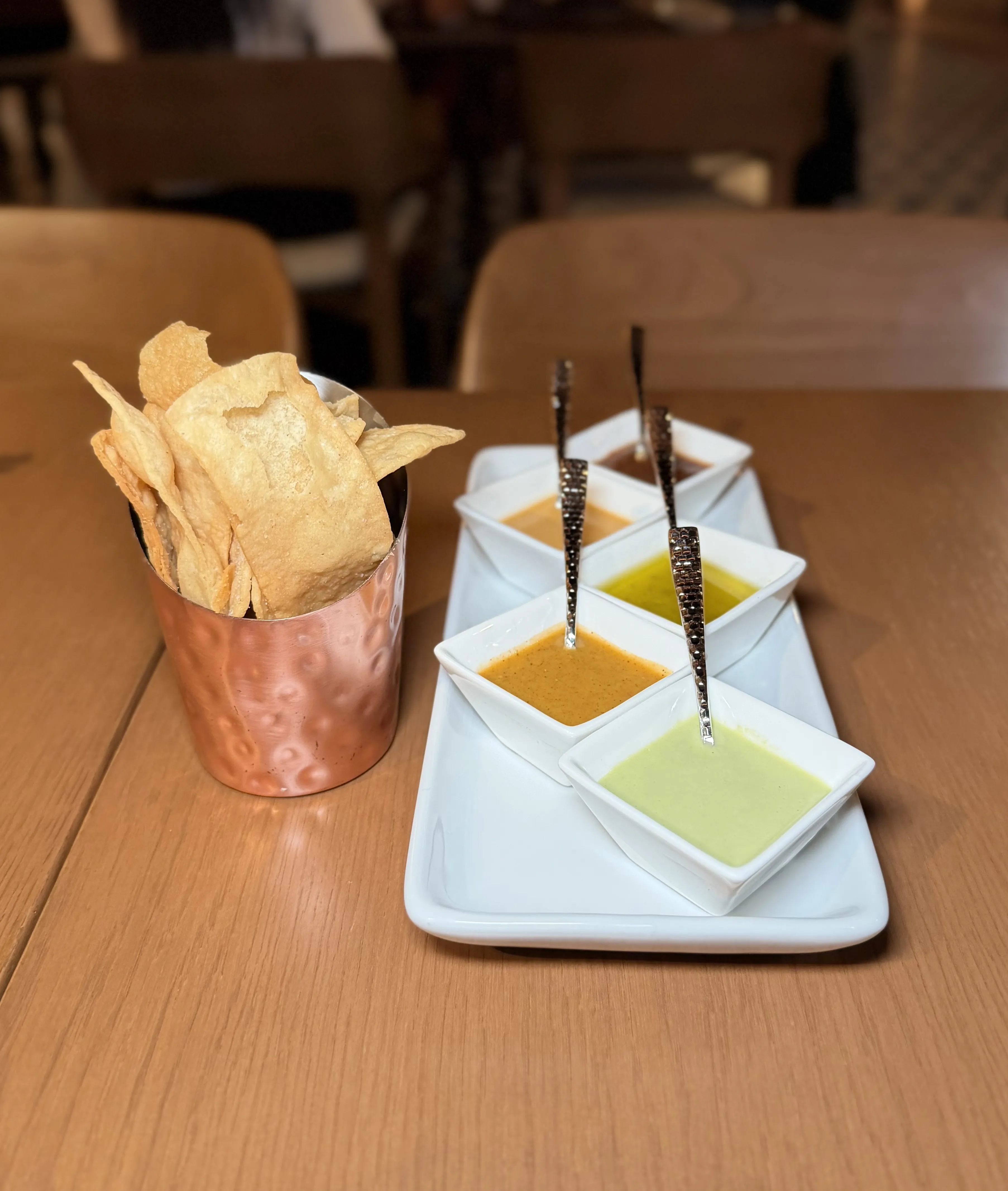 Complimentary tortilla chips with colorful house-made salsas