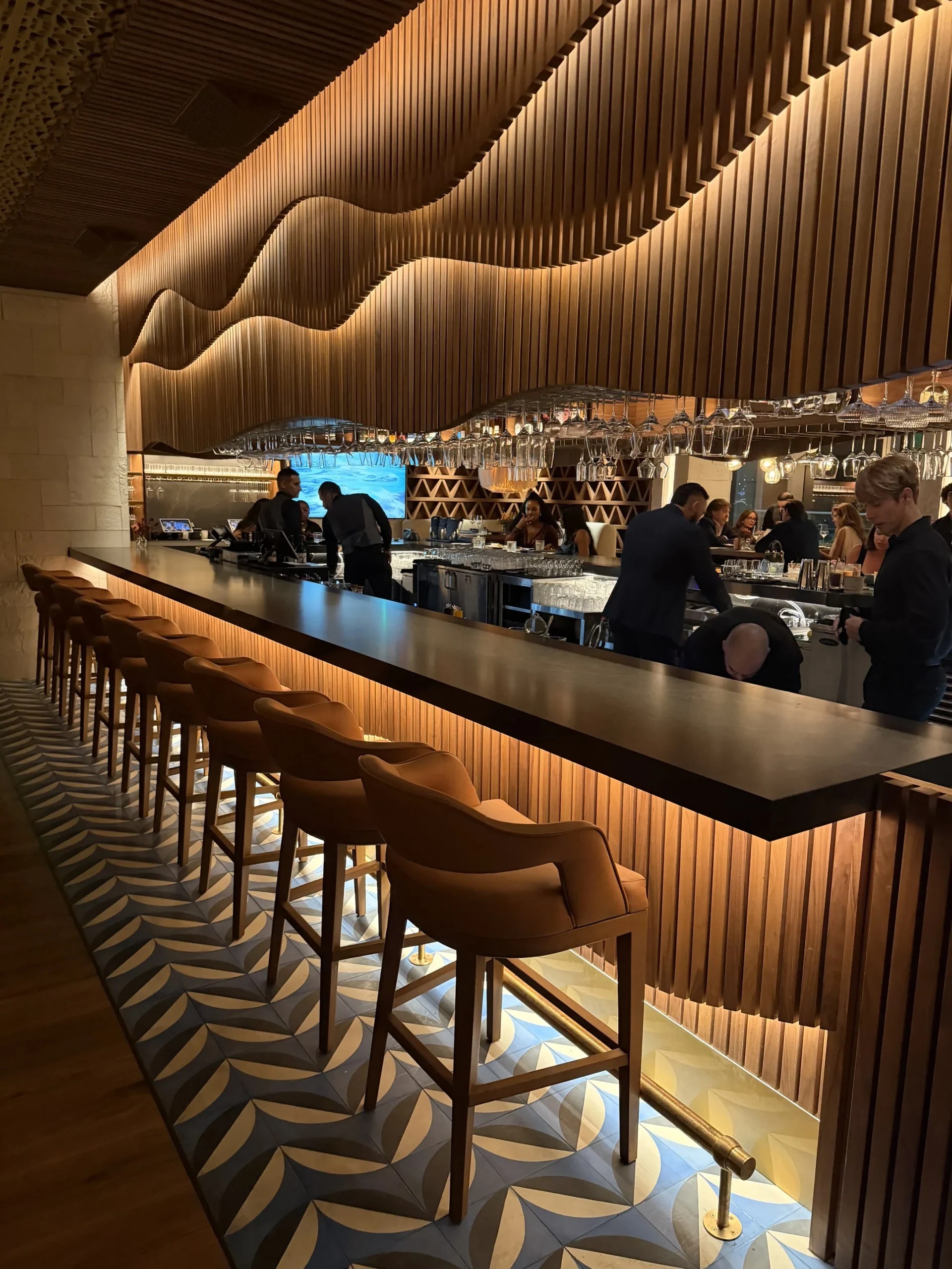 Upscale Mexican restaurant dining room with woven wooden ceiling