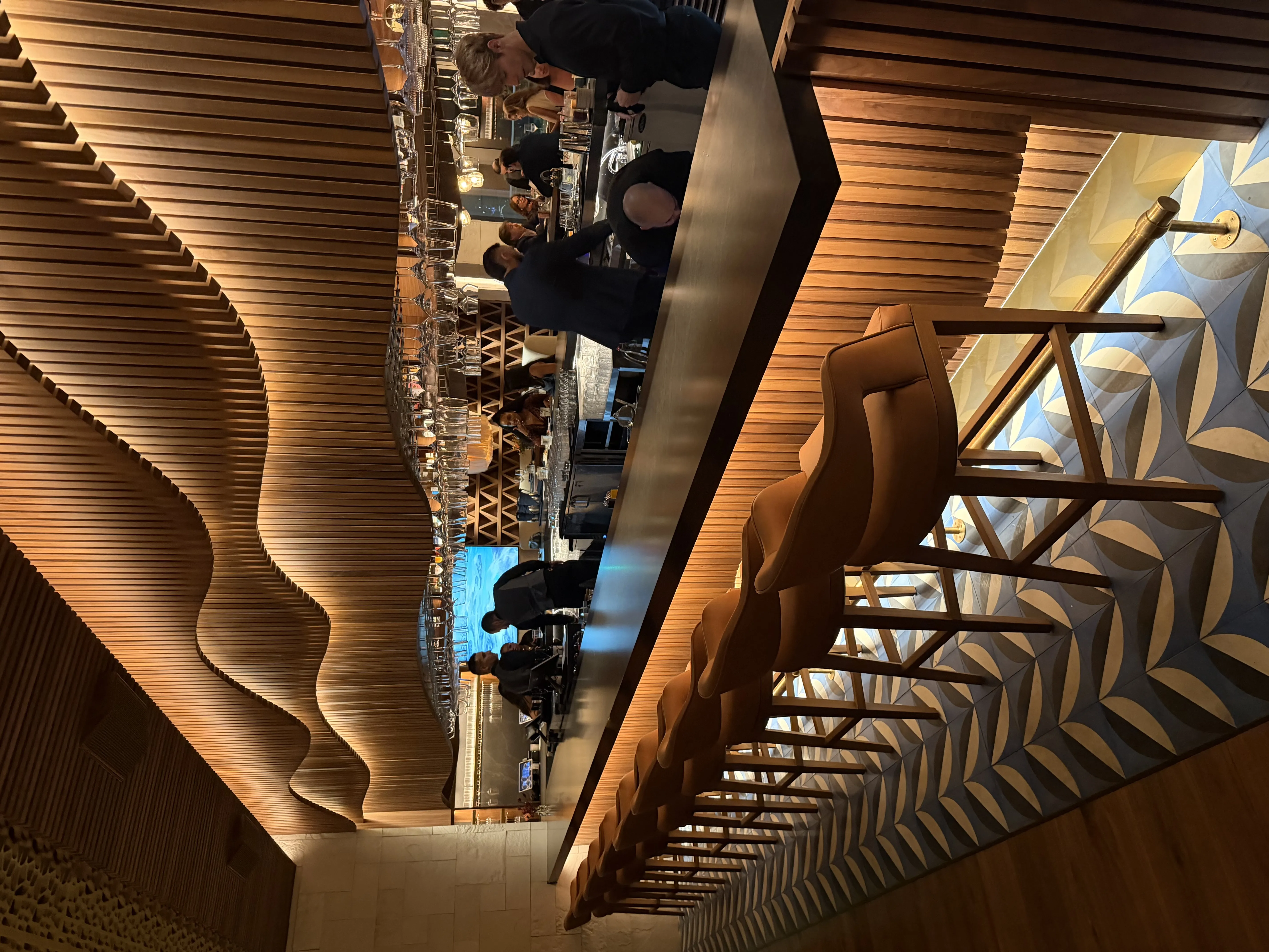 Upscale Mexican restaurant dining room with woven wooden ceiling